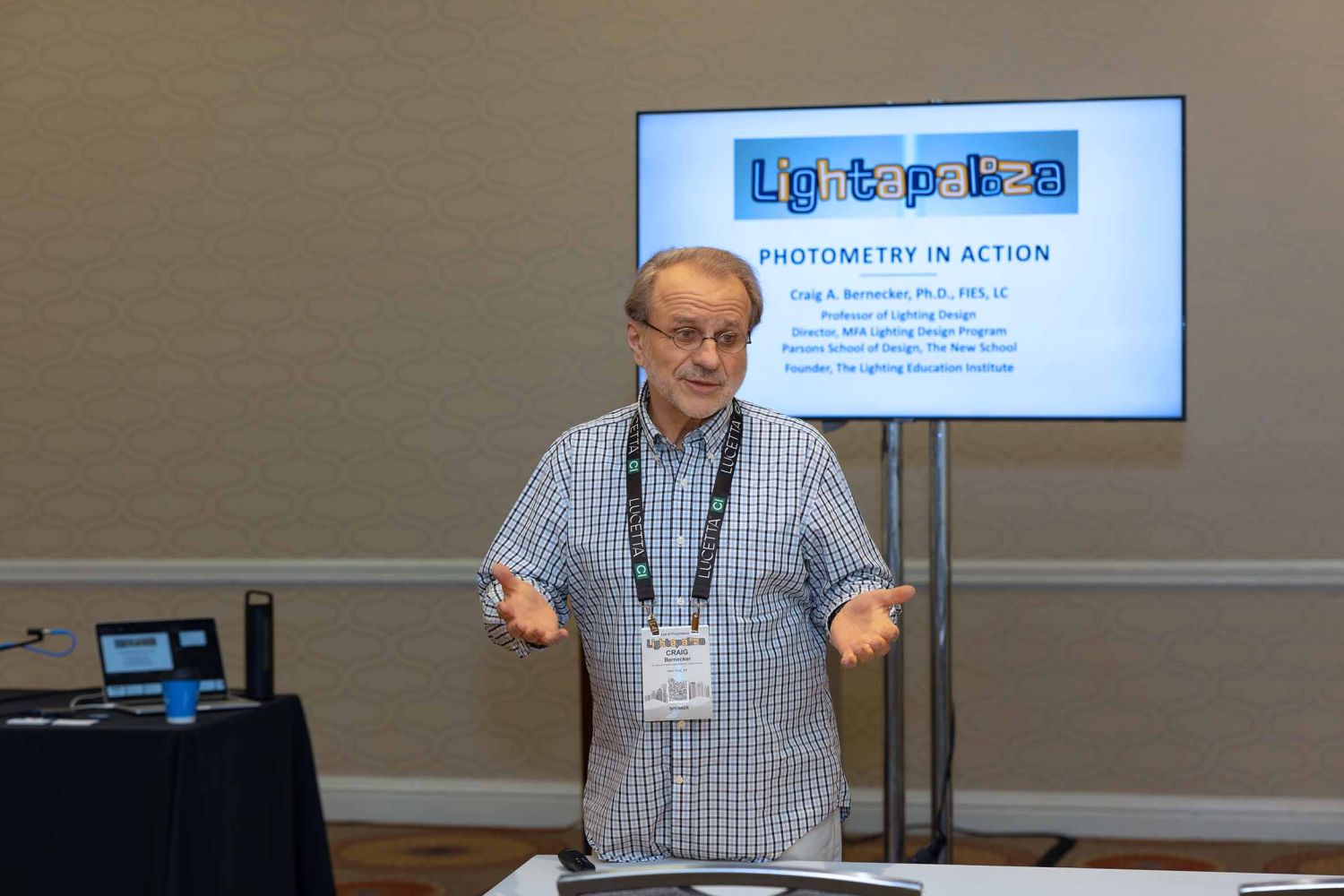 Man lecturing in front of a class about photometry