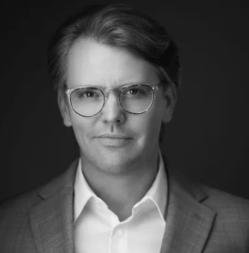 Black-and-white portrait of a Lightapalooza team member, Ron Callis